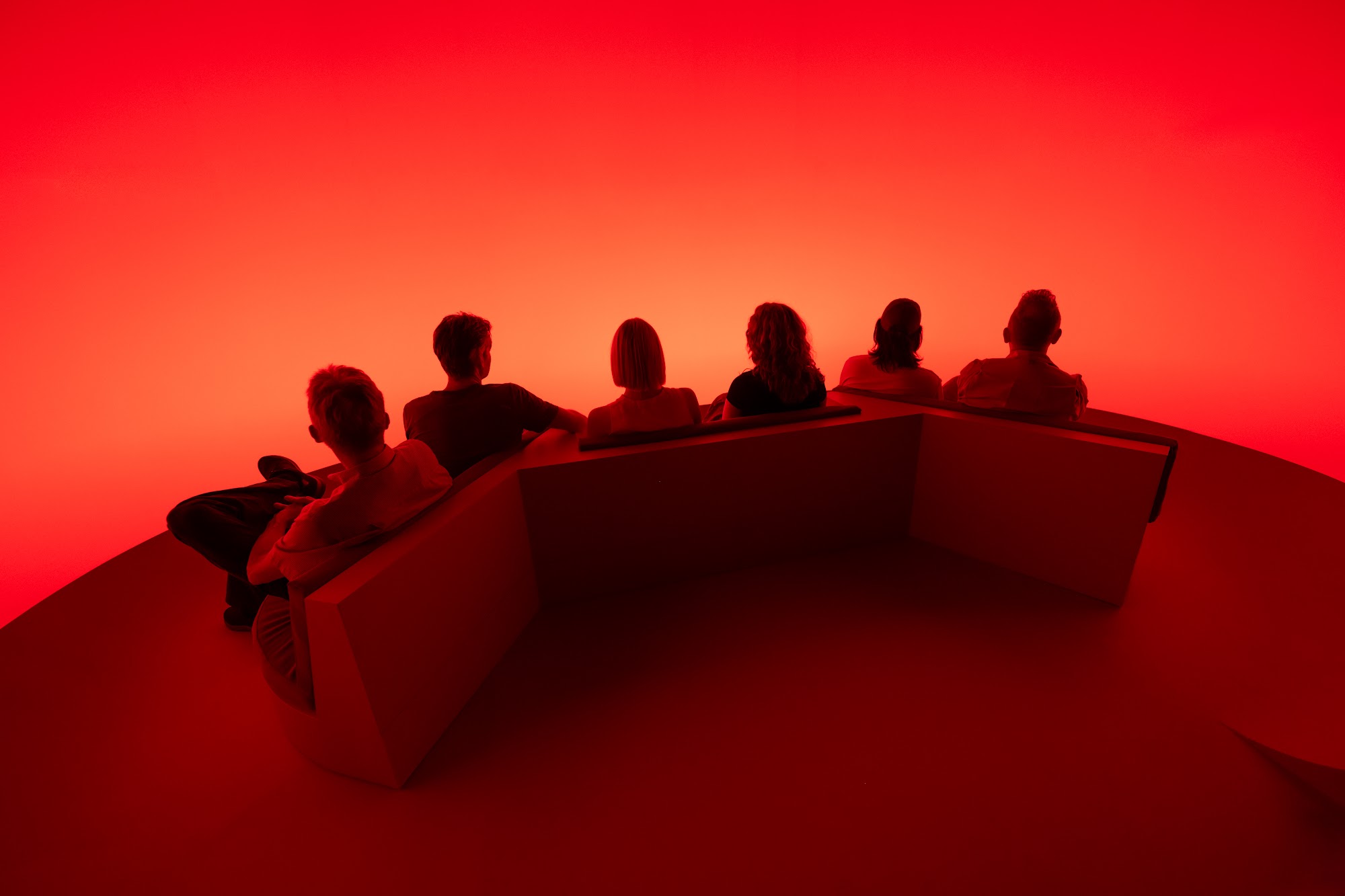 A group on the stepped platform of Chasing the Dot in red light