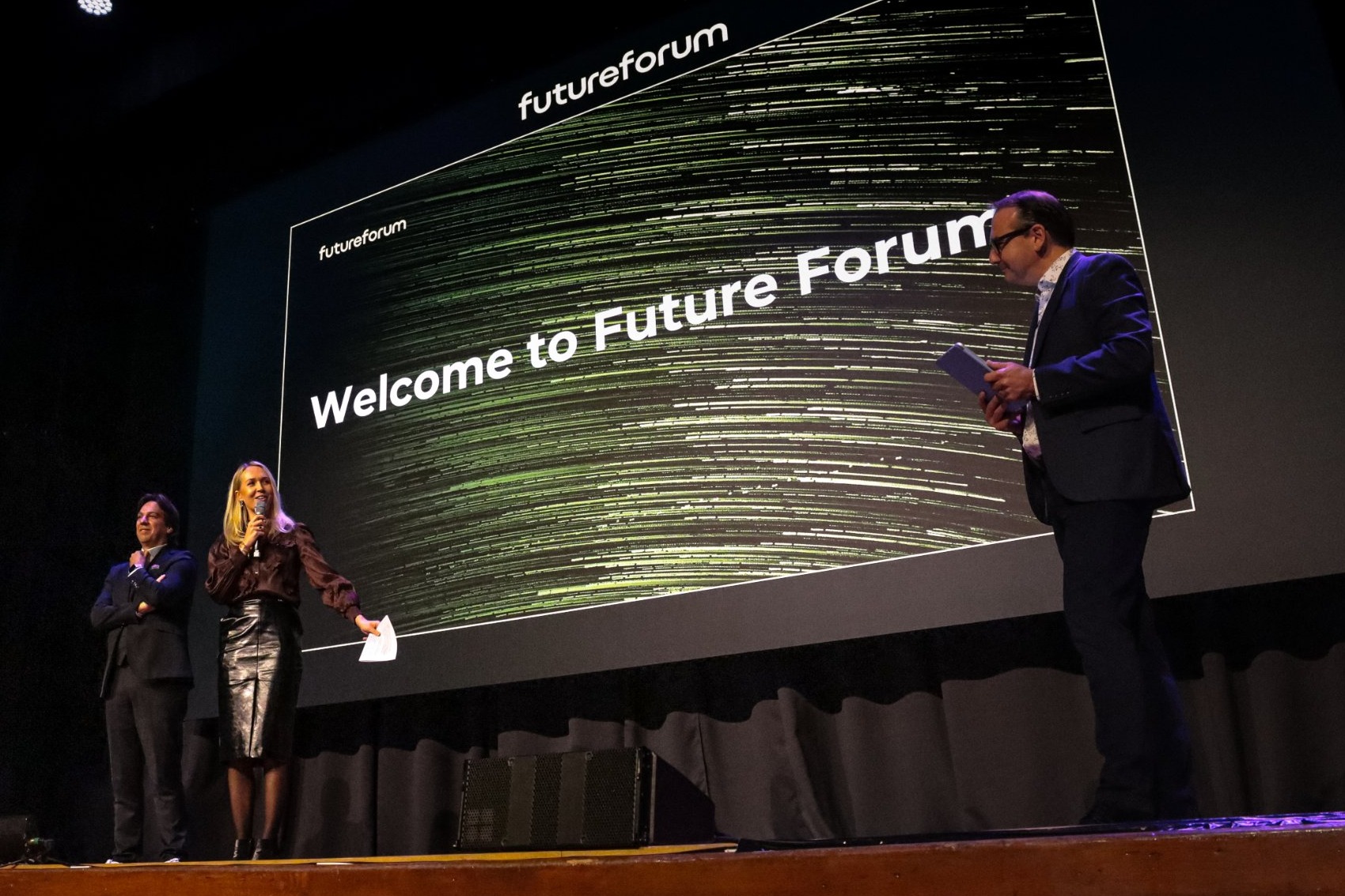 Emilie Edberg and Joseph D’Anna on the Vision Hall stage beneath a screen reading Welcome to Future Forum