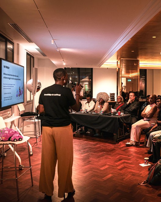 A founder pitches to the panel and audience in the Salon